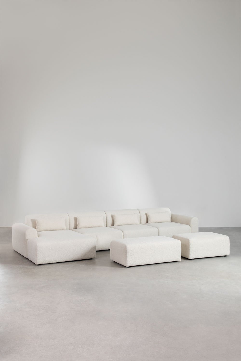 Sofà modulare con chaise longue sinistra a 4 pezzi con 2 pouf in tessuto bouclé Borjan