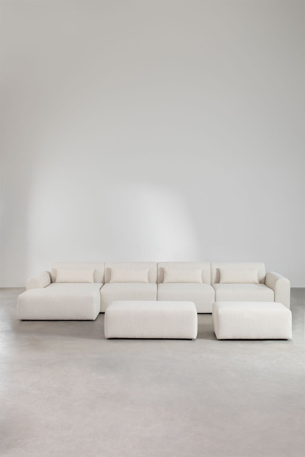 Sofà modulare con chaise longue sinistra a 4 pezzi con 2 pouf in tessuto bouclé Borjan