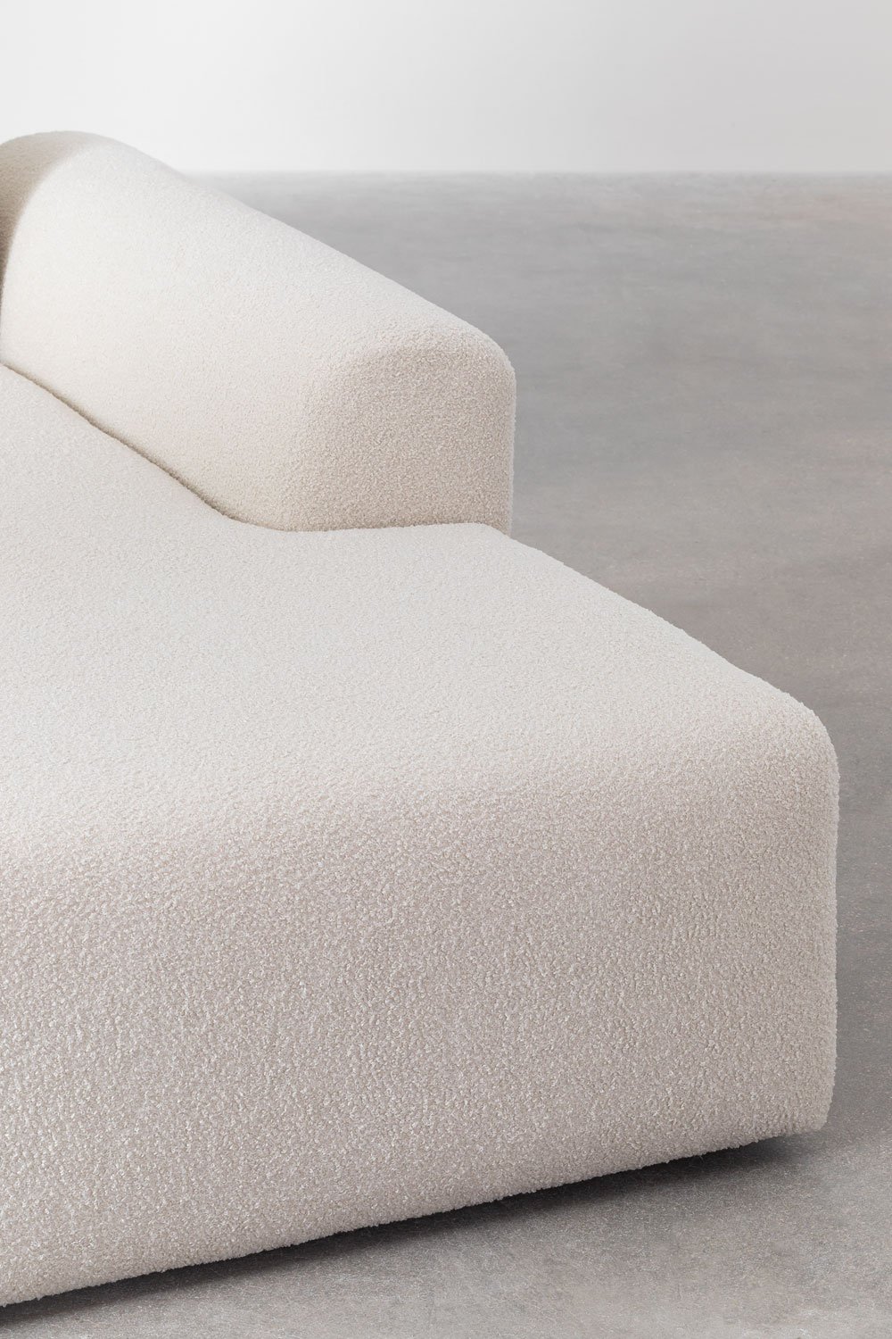 Sofà modulare con chaise longue destra di 4 pezzi 2 pouf in tessuto bouclé Borjan