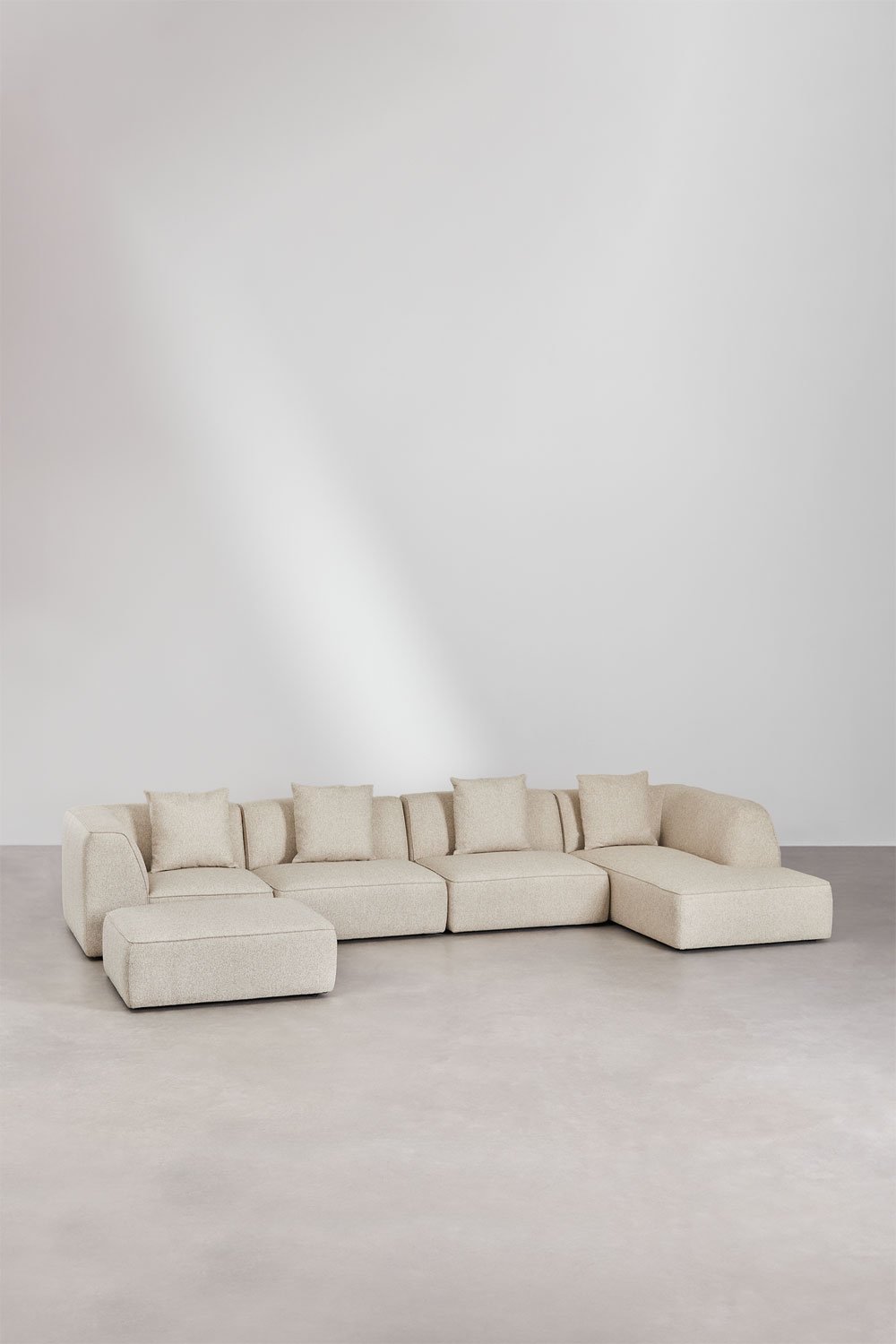 Divano modulare con chaise longue destra a 4 pezzi con pouf rivestito Cardea