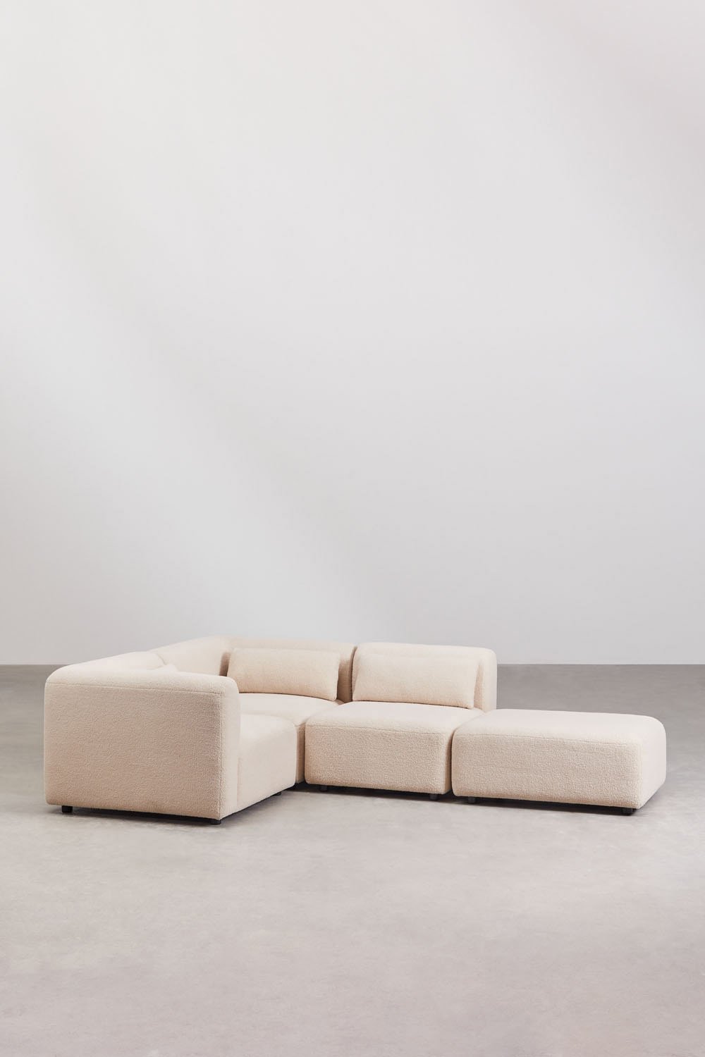 Divano angolare componibile in 3 pezzi con pouf Fogler