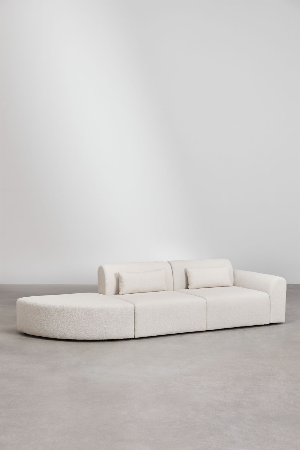 Divano componibile angolare destro in 2 pezzi con pouf triangolare in shearling Borjan
