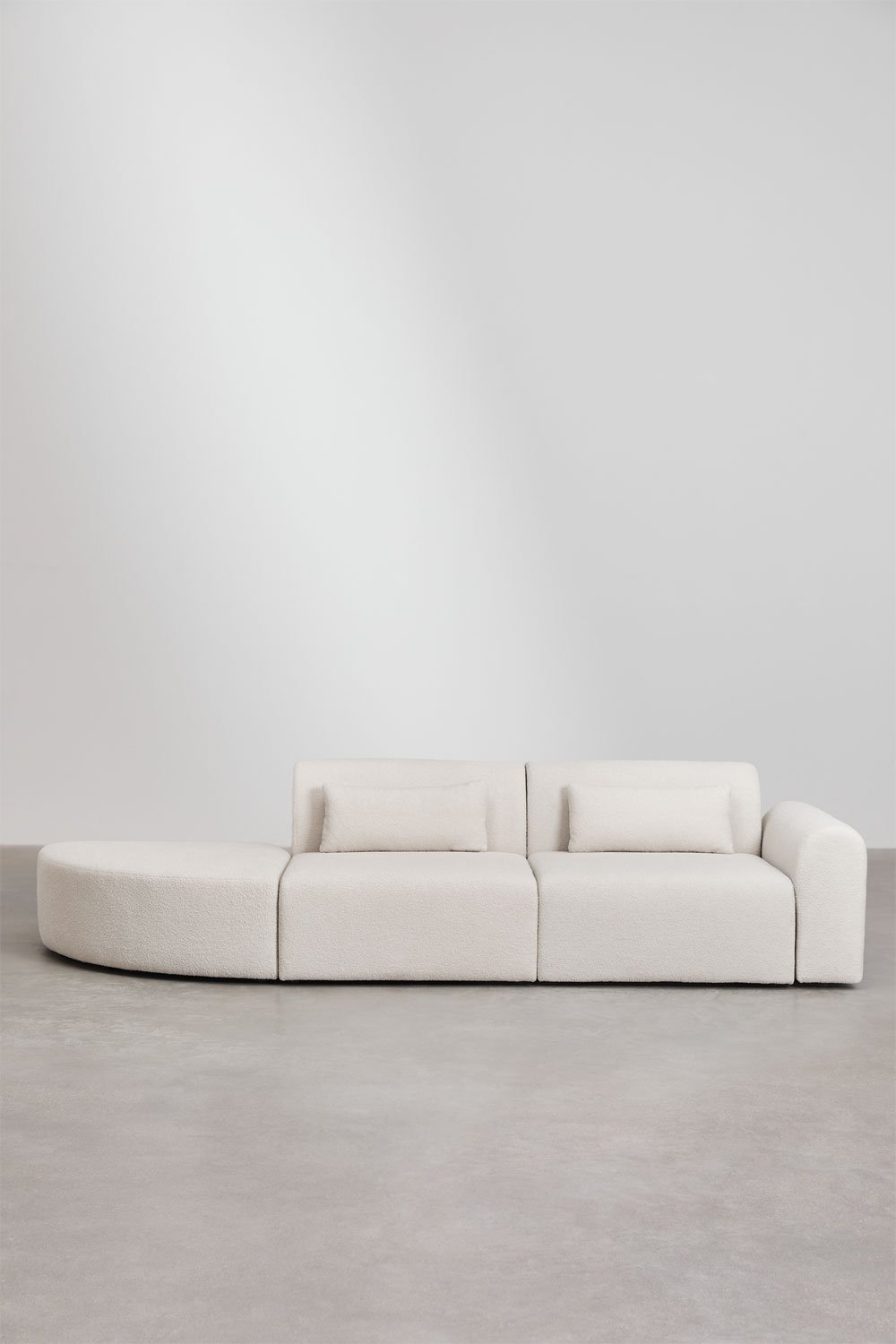 Divano componibile angolare destro in 2 pezzi con pouf triangolare in shearling Borjan