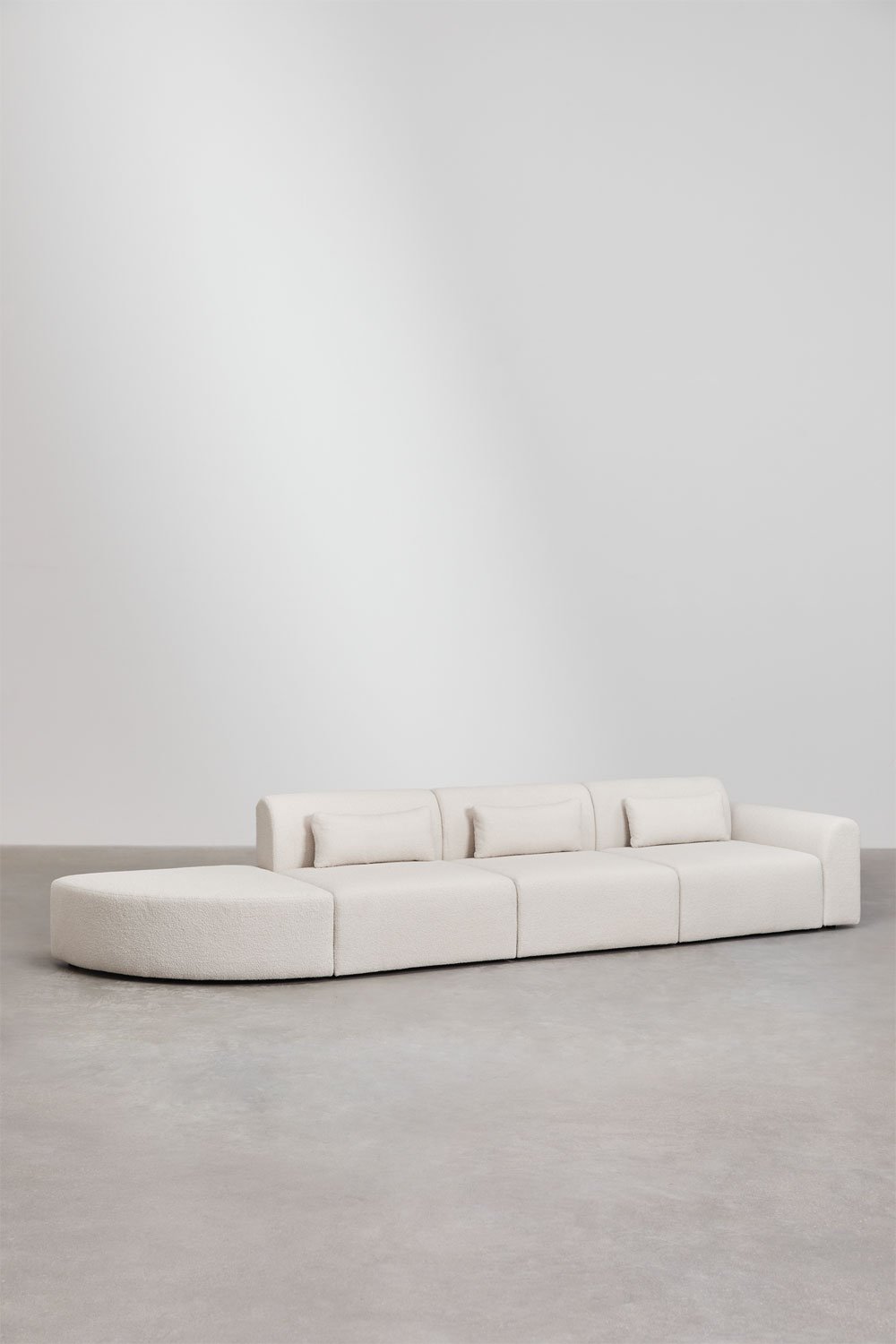 Divano componibile angolare destro in 3 pezzi con pouf triangolare in shearling Borjan