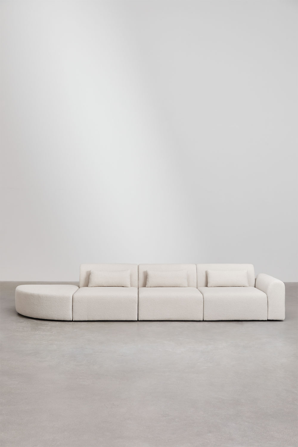 Divano componibile angolare destro in 3 pezzi con pouf triangolare in shearling Borjan