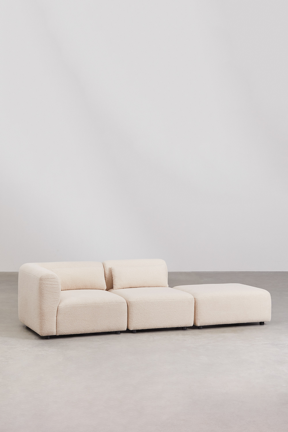 Divano componibile angolare in 2 pezzi con pouf Fogler