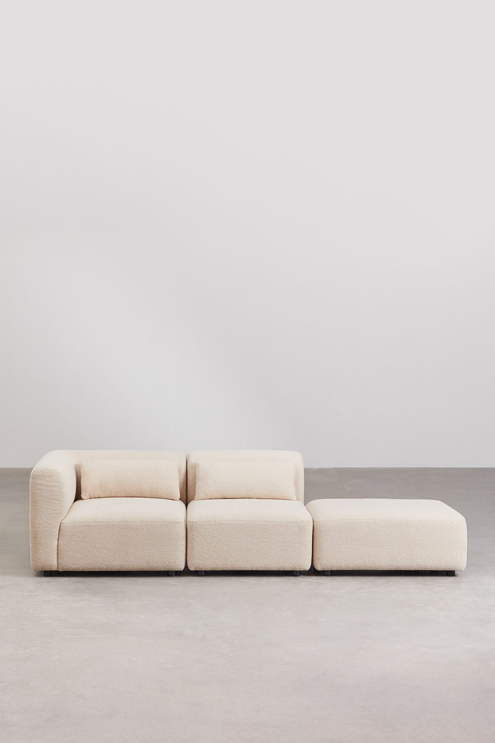 Divano componibile angolare in 2 pezzi con pouf Fogler