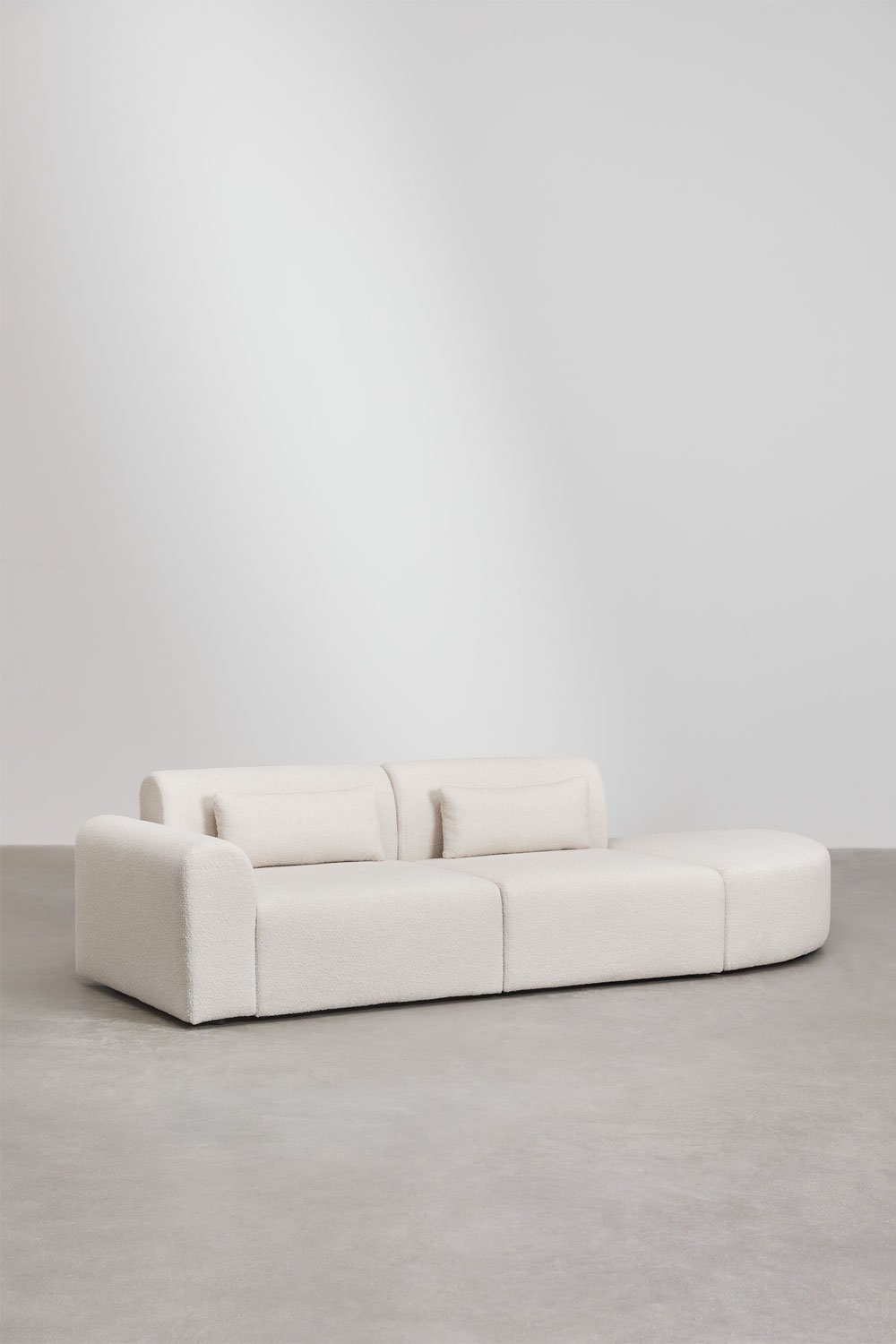 Divano componibile angolare sinistro in 2 pezzi con pouf triangolare in shearling Borjan