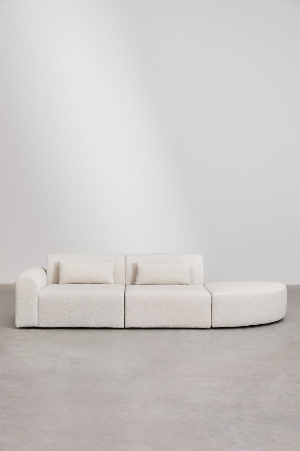Divano componibile angolare sinistro in 2 pezzi con pouf triangolare in shearling Borjan
