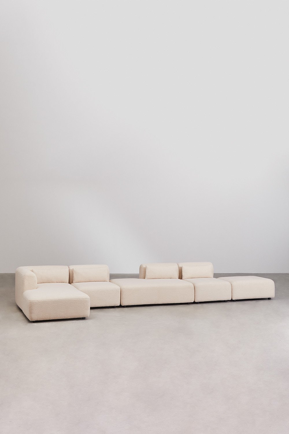 Divano componibile chaise longue angolare sinistro in 4 pezzi con chaise e puff Fogler