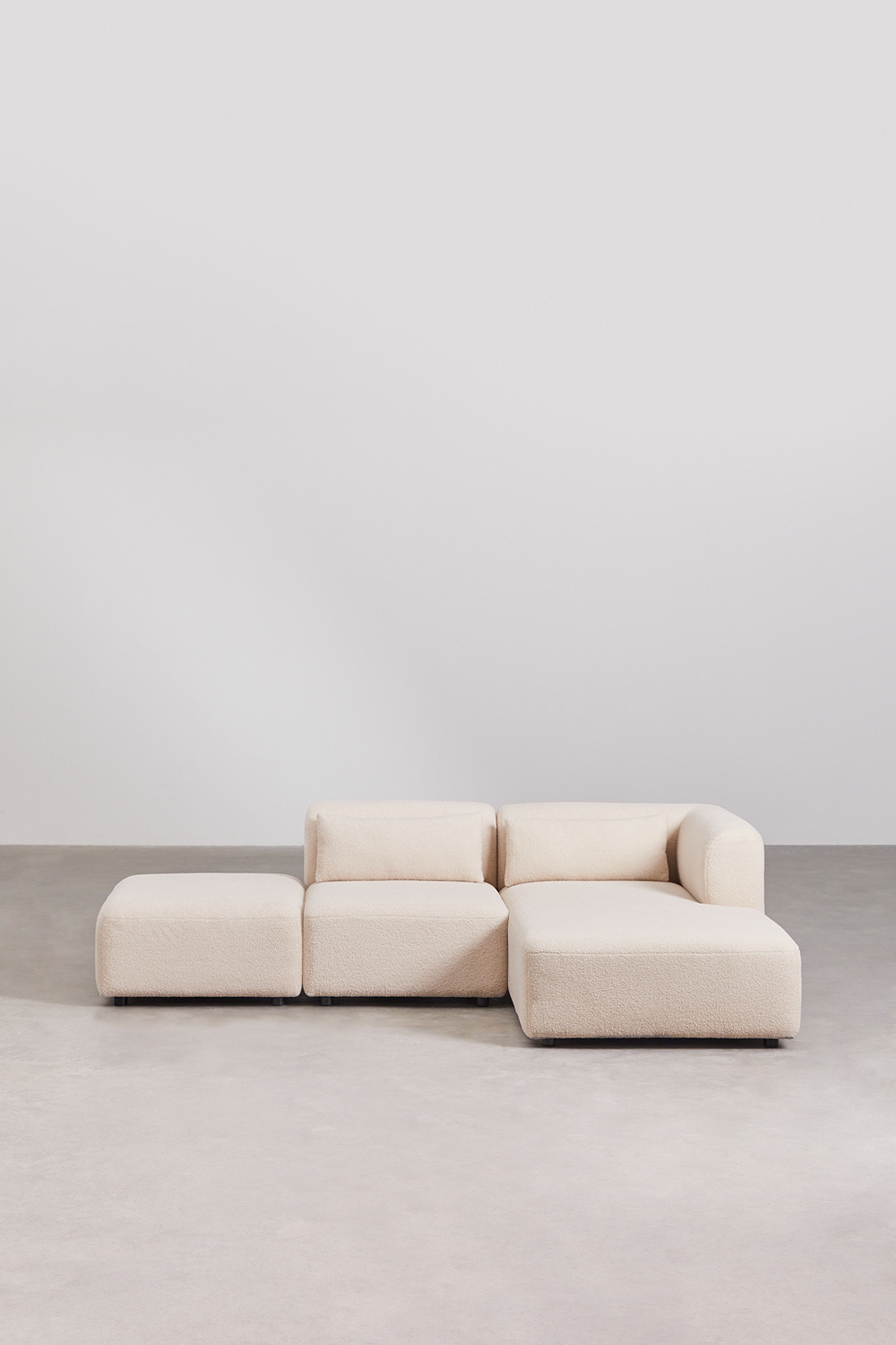 Divano componibile chaise longue destra in 2 pezzi con pouf Fogler
