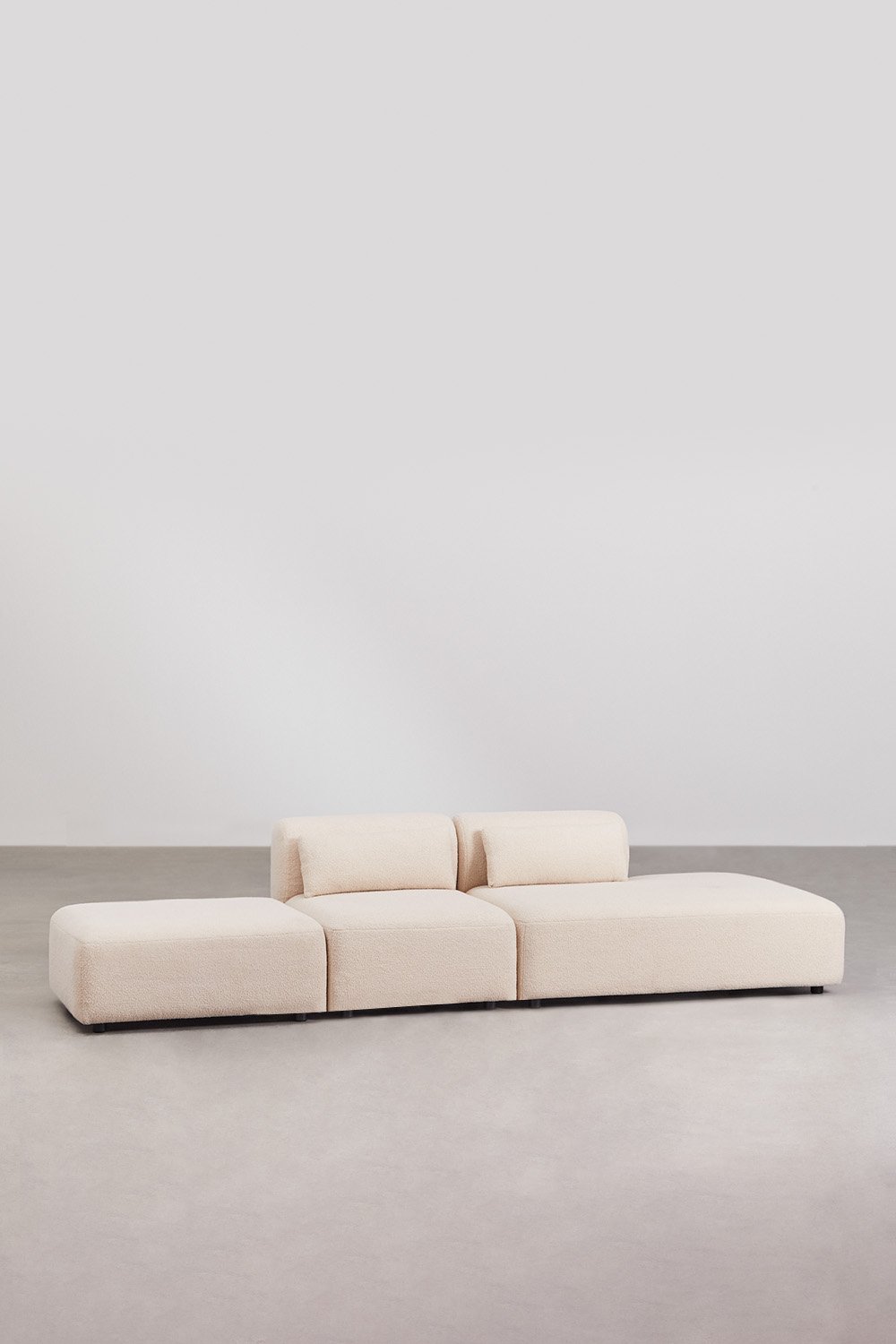 Divano componibile in 2 pezzi con chaise longue destra e pouf Fogler