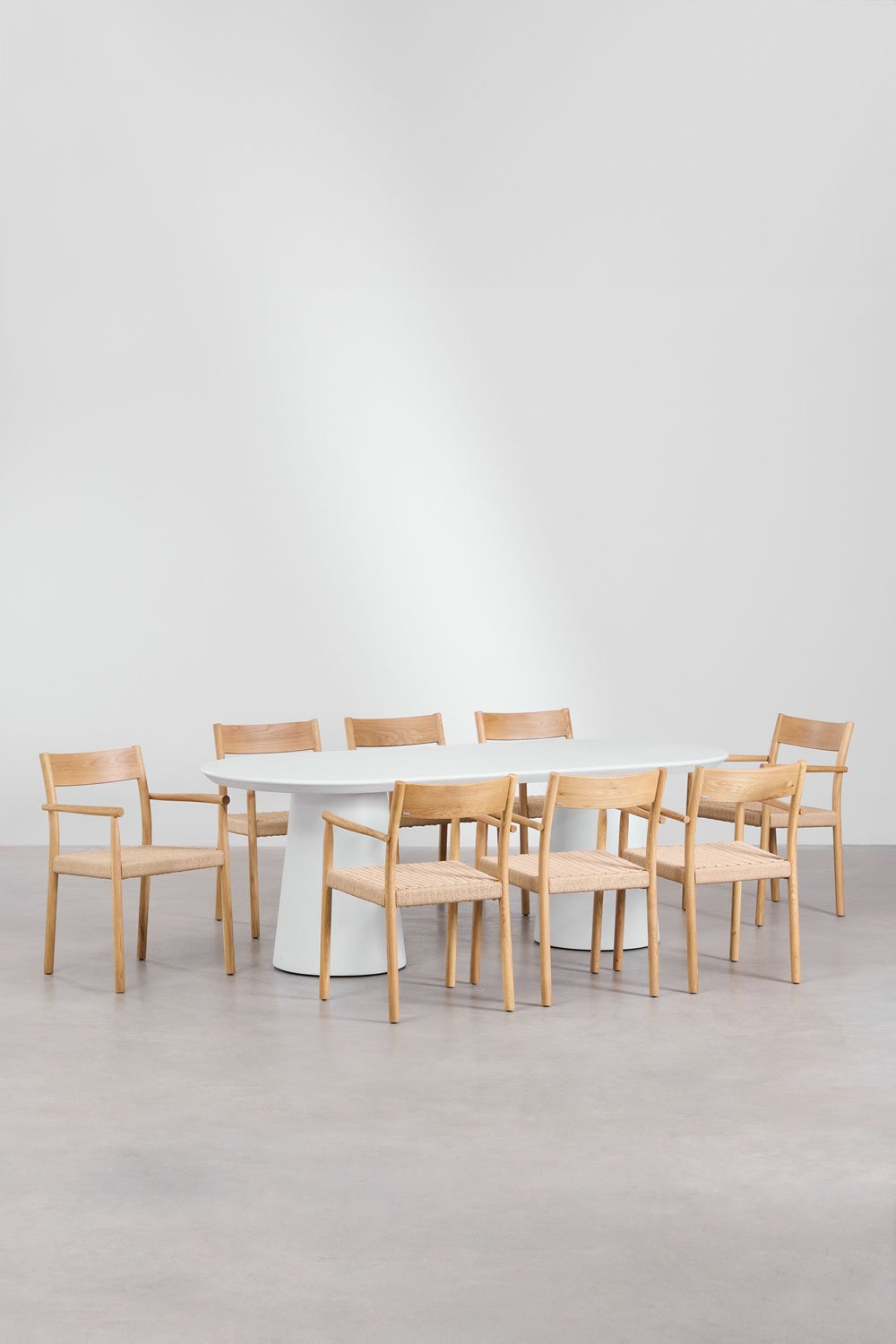 Set da tavolo ovale in cemento (220x95 cm) Noemi e 8 sedie da pranzo in legno di rovere e corda intrecciata Mara